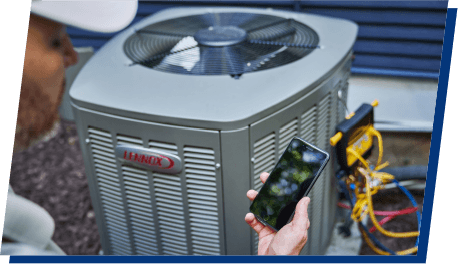Technician running diagnostics on an air conditioner